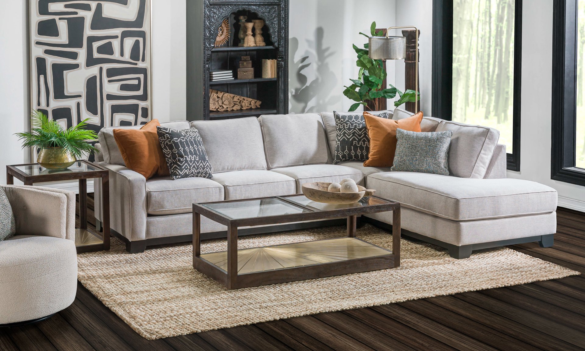 Neutral grey sectional with accent pillows.