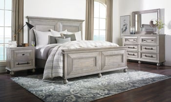 Traditional cottage style panel bed with molding and bun feet in weathered Gray finish.