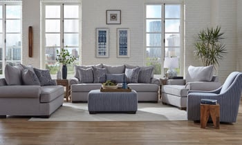 Room scene of Lockwood Granite Gray fabric living room set including a sofa, loveseat, chair, swivel chair and ottoman.