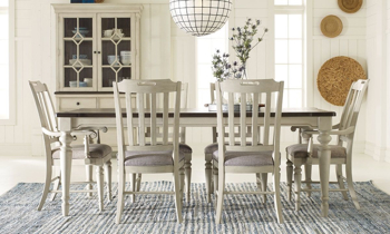 Farmhouse-inspired leg dining table with four side chairs.