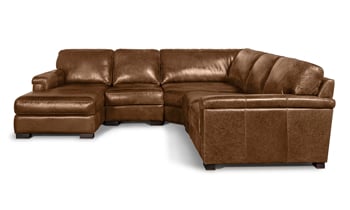 Generous 114-inch wide corner sectional with chaise made of top grain leather.