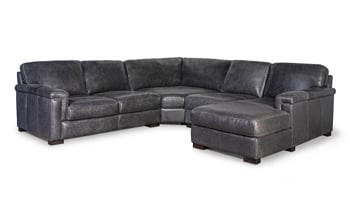 Chaise on the end of a corner sectional that was made out of top grain leather in Italy.