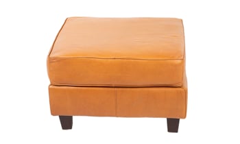 Angled shot of the Taos Butterscotch square ottoman from Rocky Mountain Leather Company.