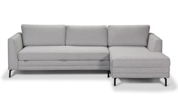 Mid-Century style sleeper sectional with chaise in a neutral fabric.